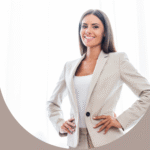 Smiling businesswoman in a beige suit.